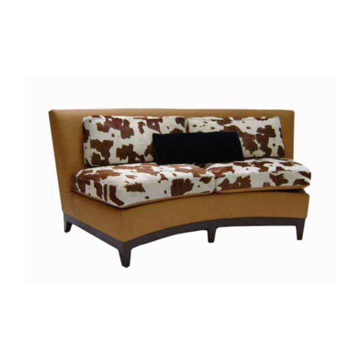 Julie lounge settee with cow hide print on back and seat cushions, brown leather frame with a wooden base and legs.