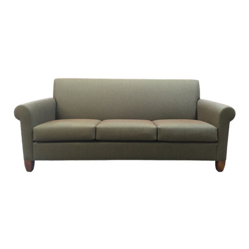 Llano lounge sofa with green upholstery and wooden legs