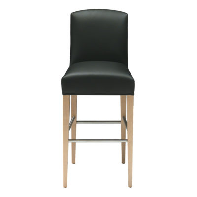 Navarro barstool upholstered in black leather, foot rails, and wooden legs.