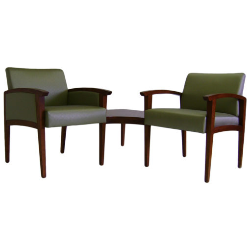 Two Sovereign Modular Seating in green upholstery with Corner Table and wooden legs and arms.