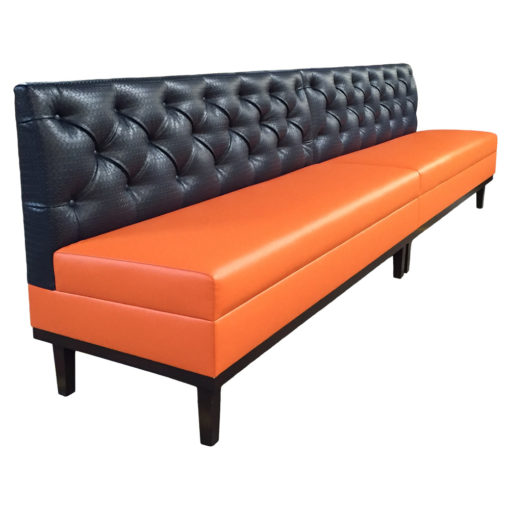Bright orange upholstered seat with tufted back upholstered back and black metal legs; Cannon Banquette