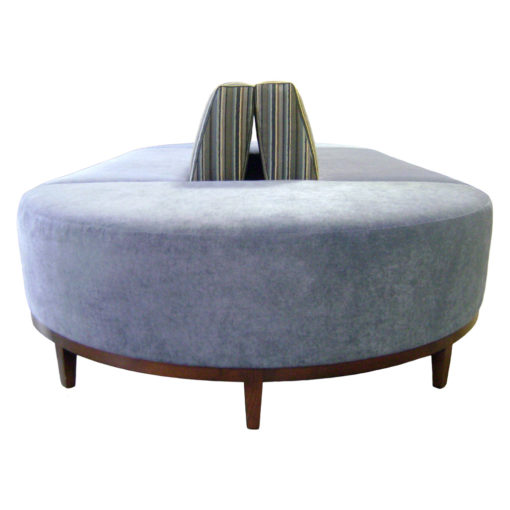 Oblong soft blue seat with striped back and wooden legs, Nelson Banquette